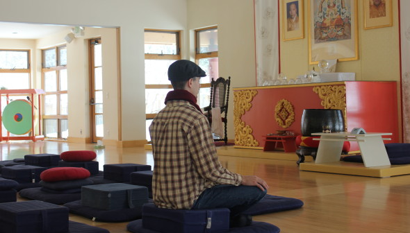 meditator on cushion