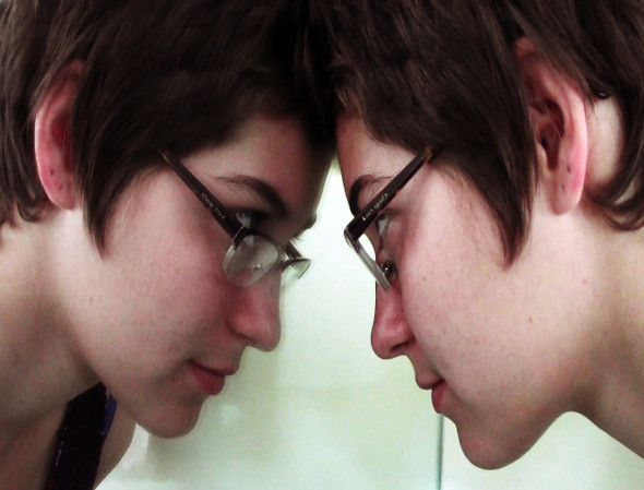 girl staring at reflection