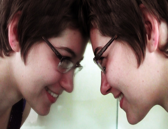 girl smiling at reflection